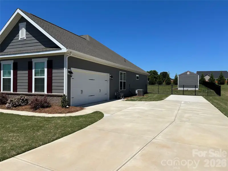 Front exterior of a new home in Yorkshire Farms, Salisbury, NC, highlighting curb appeal (Image 1). Front exterior of a new home in Yorkshire Farms, Salisbury, NC, highlighting curb appeal (Image 1).