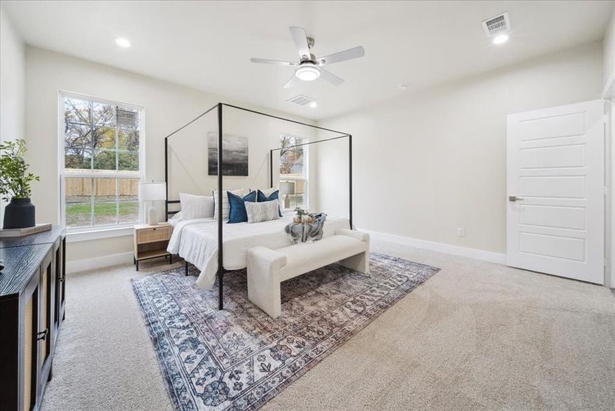 Bedroom featuring carpet floors and ceiling fan