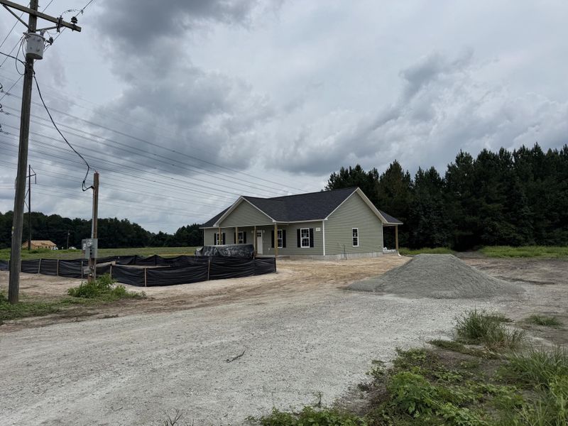 Front exterior of a new home in , St. George, SC, highlighting curb appeal (Image 2).
