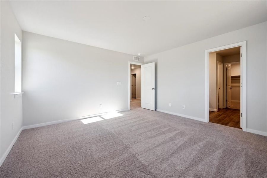 A hallway with white walls.