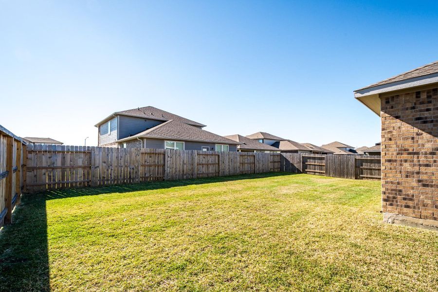 Exterior details and patio area of a home in Heights of Barbers Hill, Baytown (Image 30).