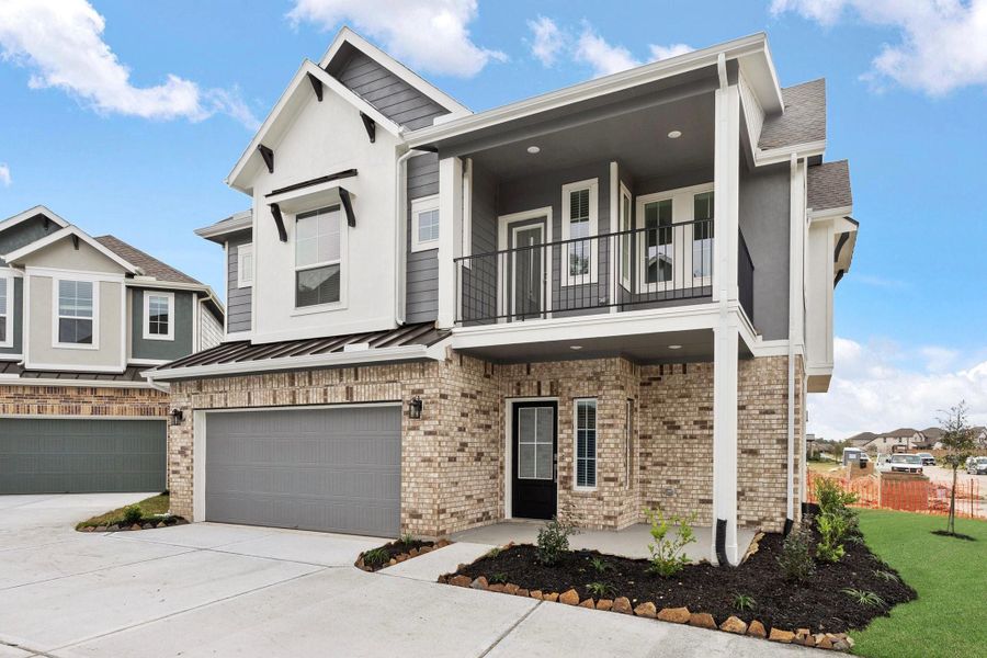Front exterior of a new home in Elyson, Katy, TX, highlighting curb appeal (Image 17). Front exterior of a new home in Elyson, Katy, TX, highlighting curb appeal (Image 17).