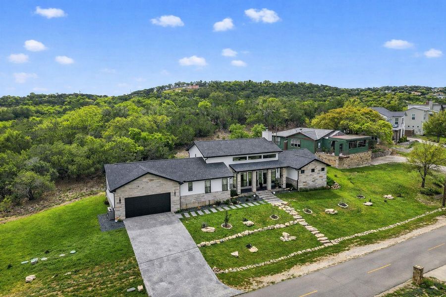 Front exterior of a new home in , Spicewood, TX, highlighting curb appeal (Image 20).