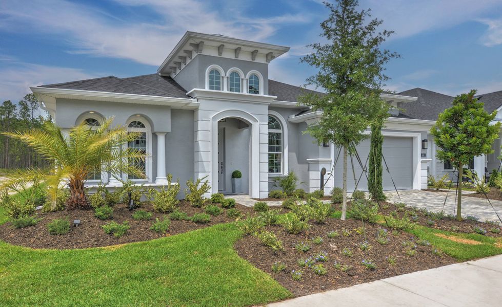 Front exterior of a new home in Plantation Bay, Ormond Beach, FL, highlighting curb appeal (Image 20).