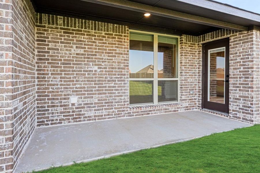 Exterior details and patio area of a home in Coyote Crossing, Godley (Image 3). Exterior details and patio area of a home in Coyote Crossing, Godley (Image 3).