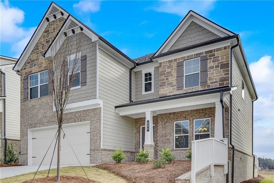 Front exterior of a new home in Summerlin, Winder, GA, highlighting curb appeal (Image 21). Front exterior of a new home in Summerlin, Winder, GA, highlighting curb appeal (Image 21).