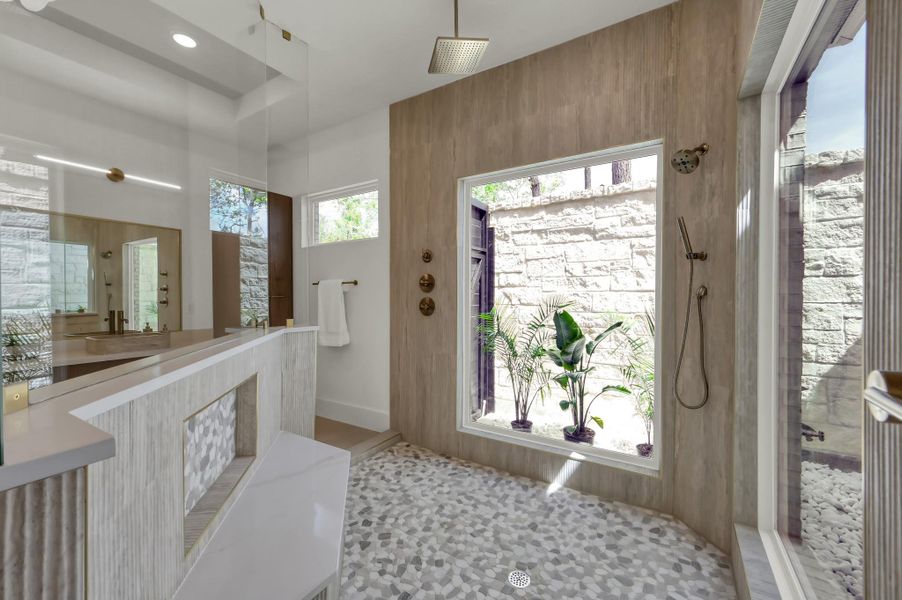 The shower was designed to blur the lines between comfort and wilderness, creating a serene, grounded feeling.