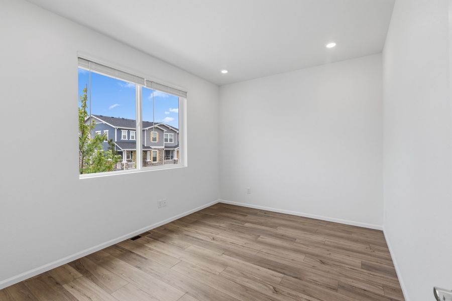Spacious, unfurnished interior of a new home in Woodrose at Painted Prairie, Aurora (Image 12).