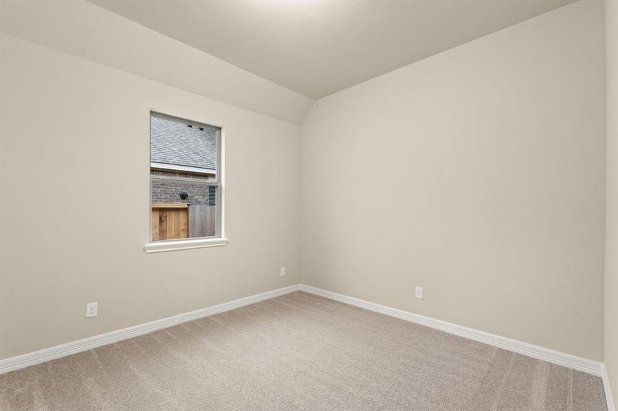 Your secondary bedroom features plush carpet, fresh paint, closet, and a large window that lets in plenty of natural lighting.