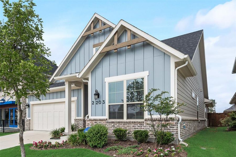 Front exterior of a new home in Bayside, Rowlett, TX, highlighting curb appeal (Image 24).