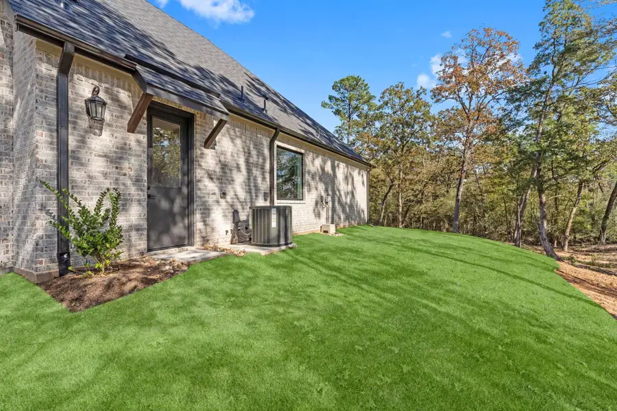Exterior details and patio area of a home in Homestead Hill, New Waverly (Image 2).
