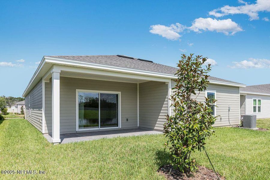 Front exterior of a new home in Coopers Meadow, Jacksonville, FL, highlighting curb appeal (Image 20). Front exterior of a new home in Coopers Meadow, Jacksonville, FL, highlighting curb appeal (Image 20).