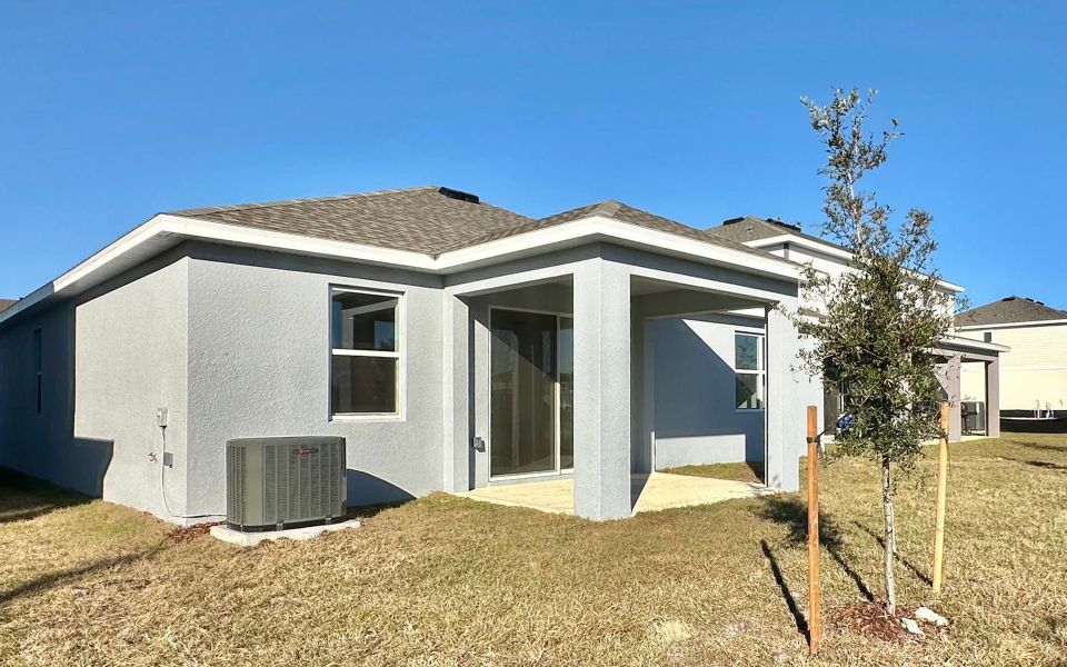 Exterior details and patio area of a home in Trinity Place, St. Cloud (Image 4). Exterior details and patio area of a home in Trinity Place, St. Cloud (Image 4).