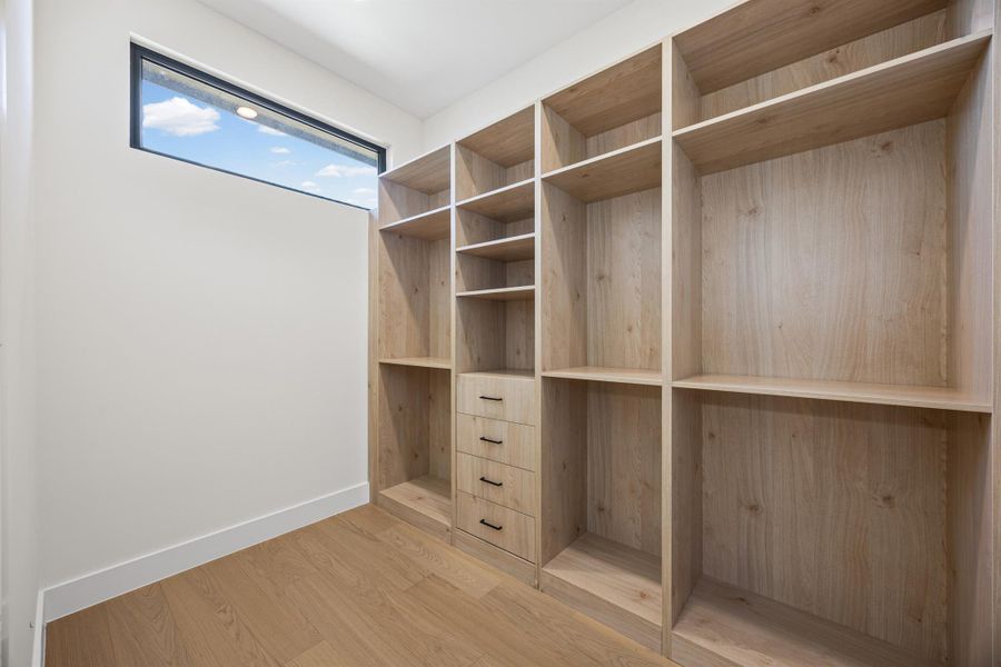 Walk in closet featuring light wood finished floors