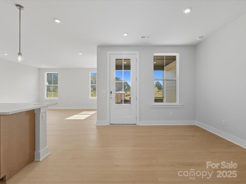 Front Entry Through 8' Glass Paned Doorway.