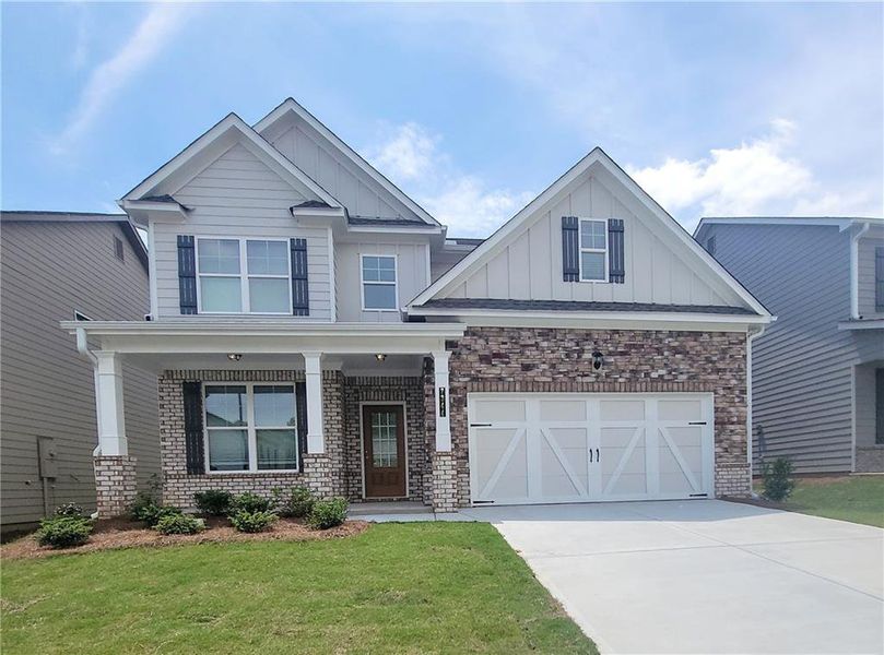 Front exterior of a new home in Clark Farms, Flowery Branch, GA, highlighting curb appeal (Image 1).