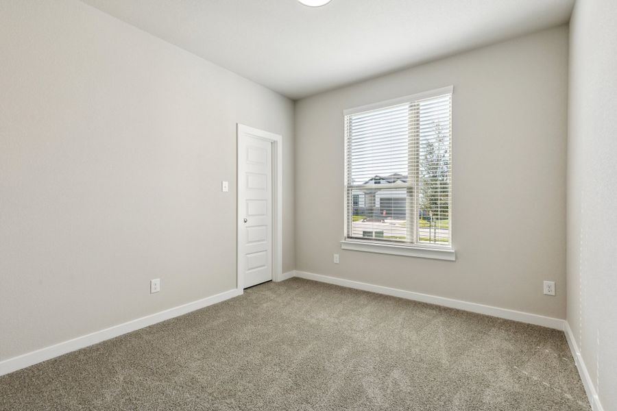 Bedroom in the Emmy II home plan by Trophy Signature Homes - REPRESENTATIVE PHOTO Bedroom in the Emmy II home plan by Trophy Signature Homes - REPRESENTATIVE PHOTO