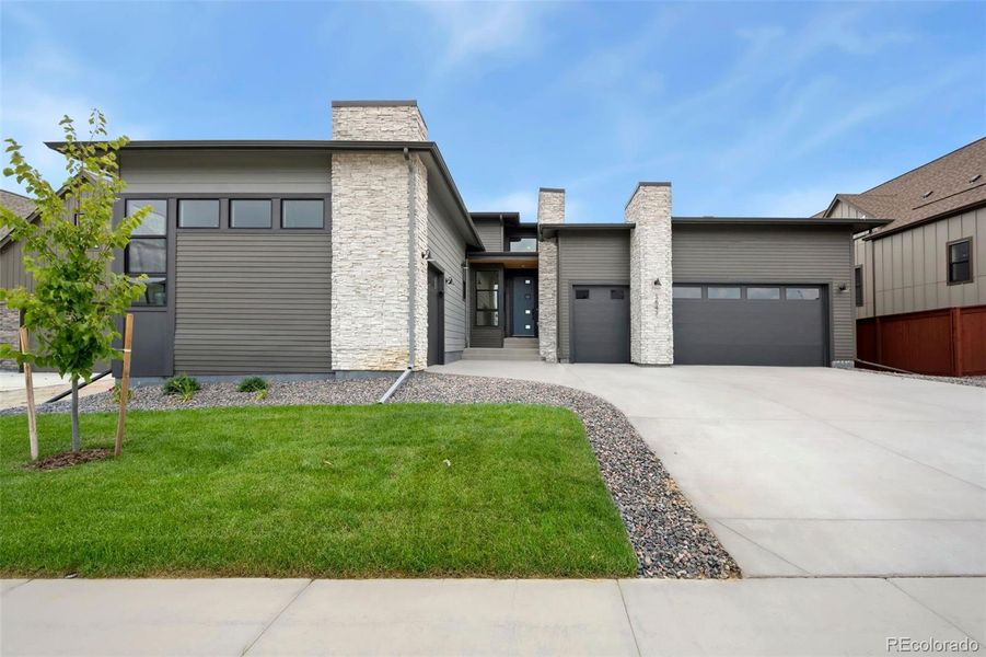 Front exterior of a new home in The Fairways at RainDance, Windsor, CO, highlighting curb appeal (Image 1).