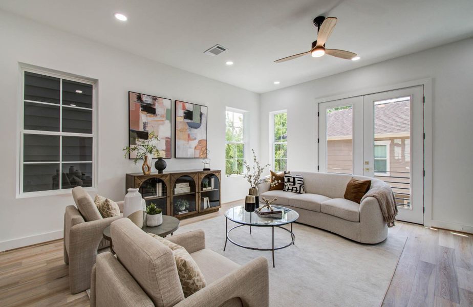 Treetop views and natural light pour into the main living area.