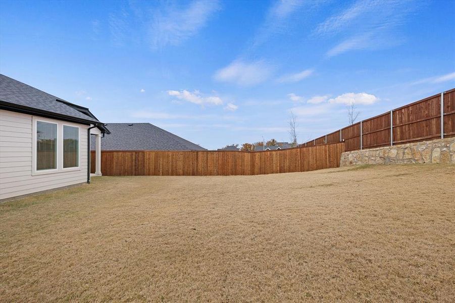 Exterior details and patio area of a home in Talon Hills, Saginaw (Image 16).