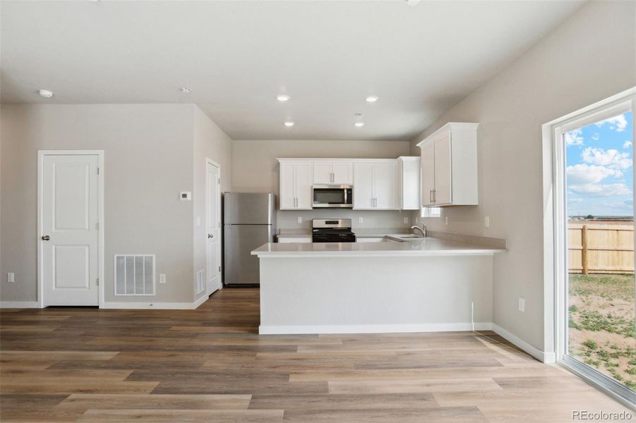 Furnished interior in a model home at Bennett Ranch in Bennett (Image 16).