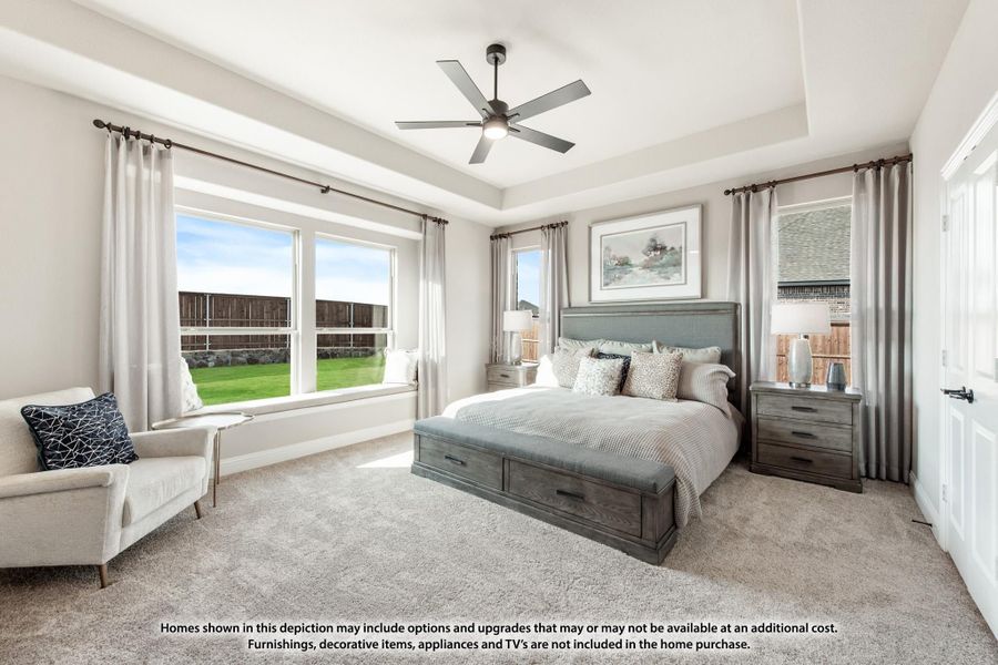 Master bedroom with tray ceiling, ceiling fan, large windows, and carpet flooring Master bedroom with tray ceiling, ceiling fan, large windows, and carpet flooring