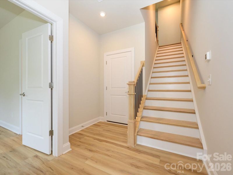 Foyer and oak box stairs and entry to first floor en suite