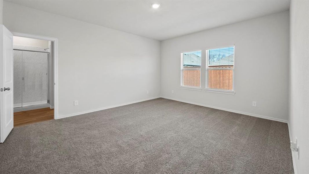Spare room with light colored carpet and recessed lighting