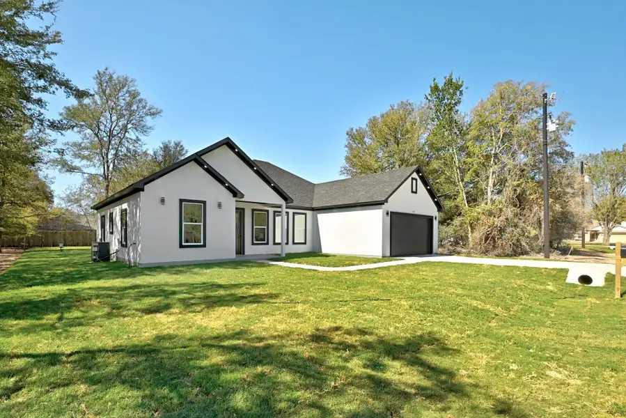 Front exterior of a new home in , Bastrop, TX, highlighting curb appeal (Image 2). Front exterior of a new home in , Bastrop, TX, highlighting curb appeal (Image 2).