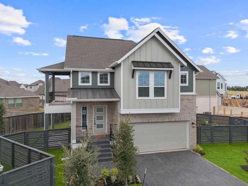 Front exterior of a new home in Bridgeland, Cypress, TX, highlighting curb appeal (Image 2). Front exterior of a new home in Bridgeland, Cypress, TX, highlighting curb appeal (Image 2).