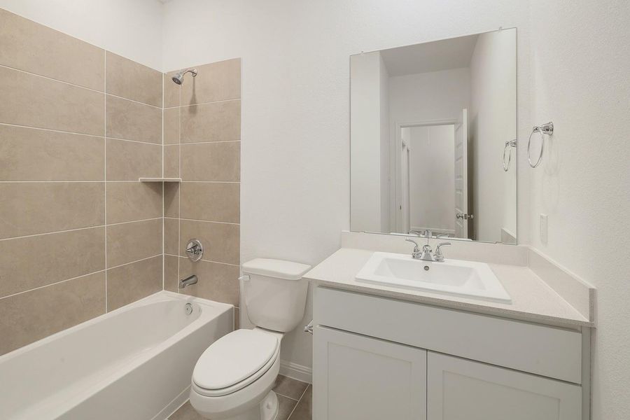 Bathroom in the Ash home plan by Trophy Signature Homes – REPRESENTATIVE PHOTO Bathroom in the Ash home plan by Trophy Signature Homes – REPRESENTATIVE PHOTO