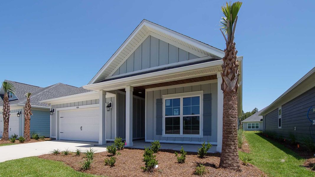 Front exterior of a new home in Breakfast Point East Phase I, Panama City Beach, FL, highlighting curb appeal (Image 2).