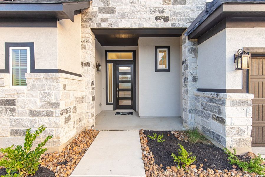 Exterior details and patio area of a home in The Reserve at Potranco Oaks, Castroville (Image 3).
