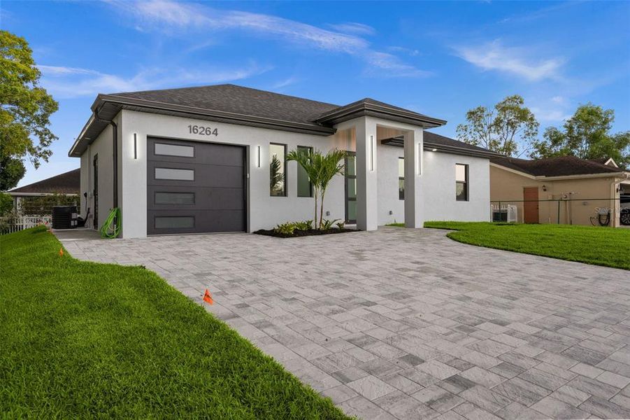 Front exterior of a new home in , North Fort Myers, FL, highlighting curb appeal (Image 1). Front exterior of a new home in , North Fort Myers, FL, highlighting curb appeal (Image 1).