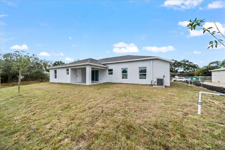 Front exterior of a new home in , Palm Bay, FL, highlighting curb appeal (Image 12). Front exterior of a new home in , Palm Bay, FL, highlighting curb appeal (Image 12).