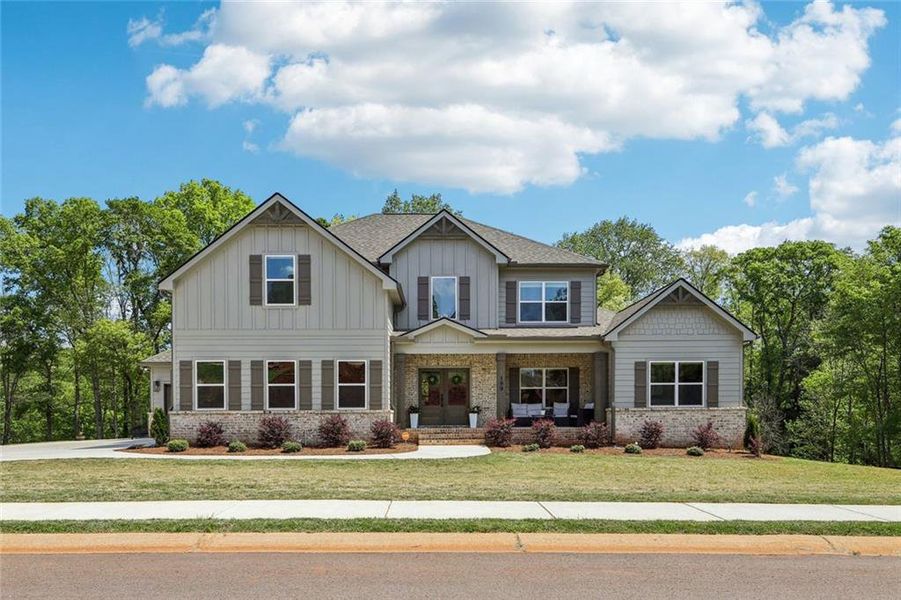 Front exterior of a new home in , Hoschton, GA, highlighting curb appeal (Image 29).