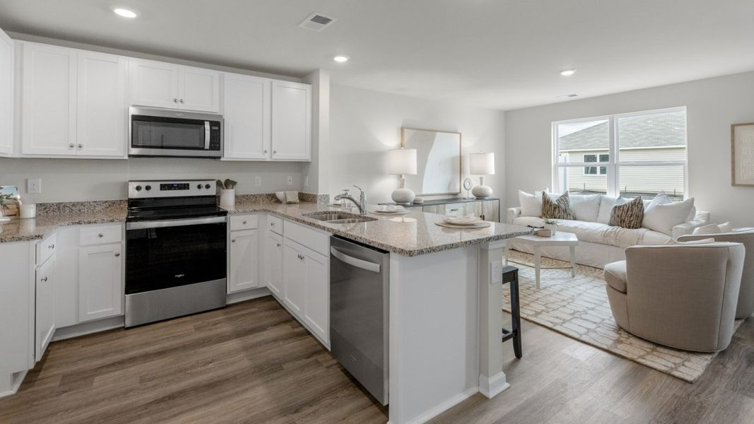 Representative furnished interior of a home built from the PEARSON TH by D.R. Horton in The Cove at Glenns Bay, Surfside Beach (Image 5).