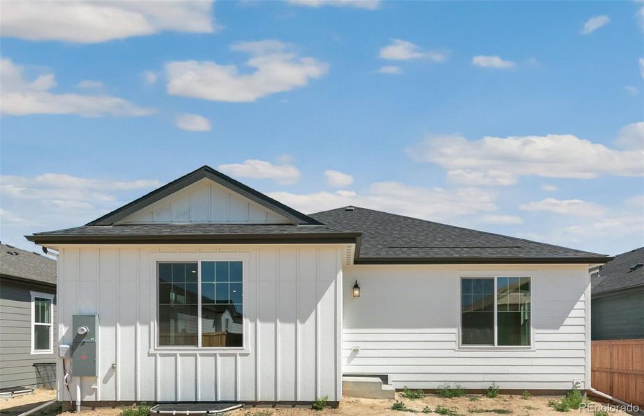 Front exterior of a new home in Farmlore, Brighton, CO, highlighting curb appeal (Image 17).
