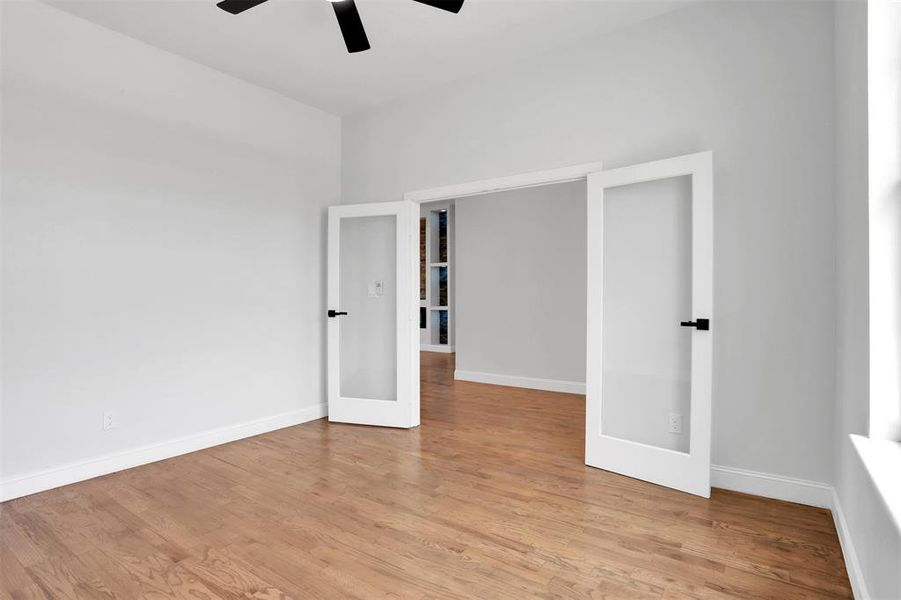 Unfurnished bedroom featuring light hardwood / wood-style floors and ceiling fan