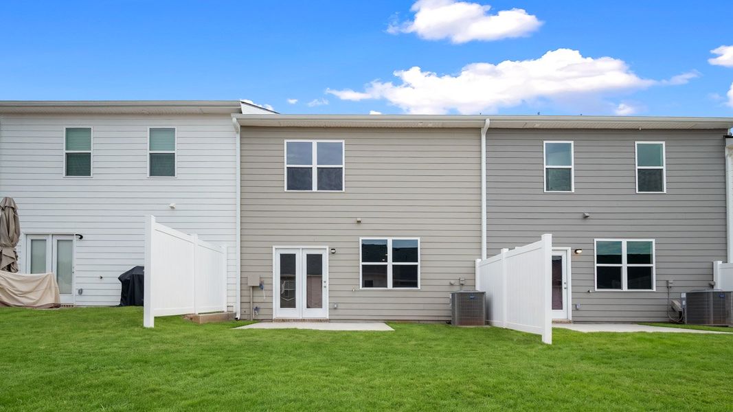 Exterior details and patio area of a home in Inverness at Sugarloaf, Lawrenceville (Image 2).