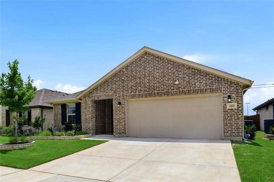 Front exterior of a new home in Stark Farms, Denton, TX, highlighting curb appeal (Image 19). Front exterior of a new home in Stark Farms, Denton, TX, highlighting curb appeal (Image 19).