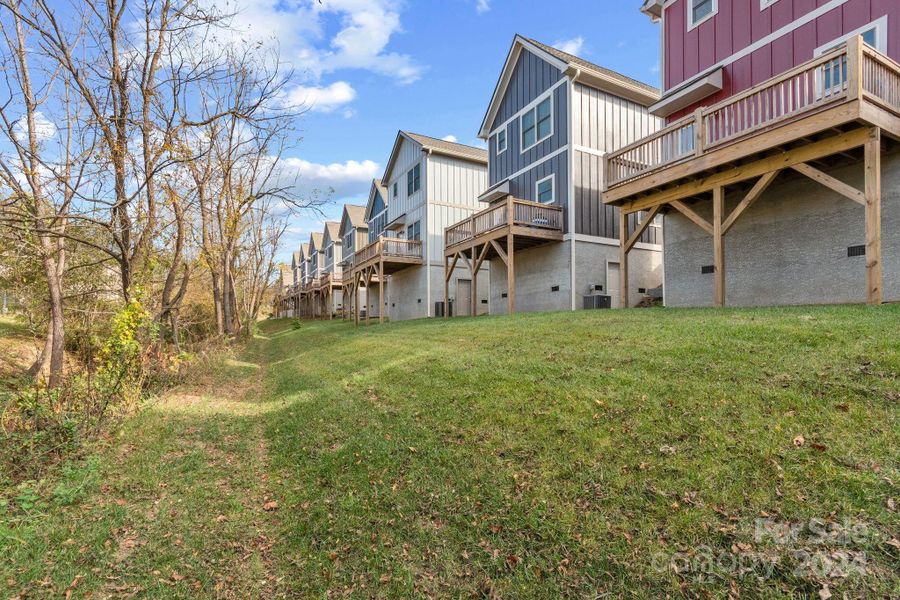 Front exterior of a new home in , Weaverville, NC, highlighting curb appeal (Image 1).