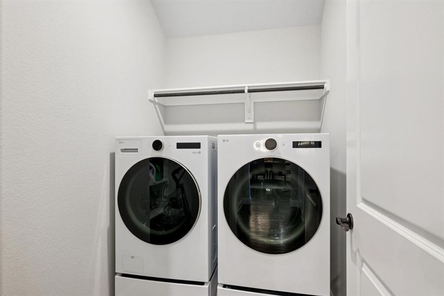 Laundry room featuring washer and clothes dryer Laundry room featuring washer and clothes dryer