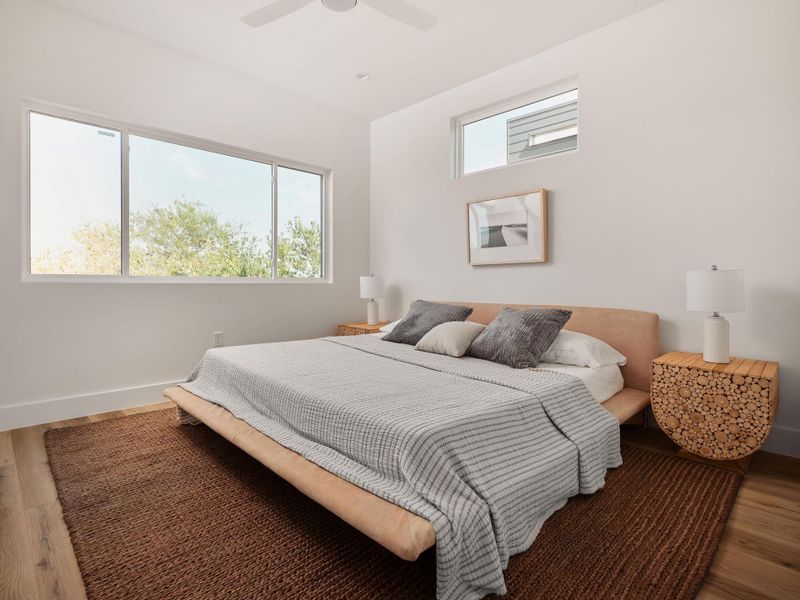 Bedroom featuring wood finished floors and a ceiling fan