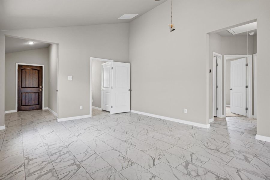 Polished tile flooring and high vaulted ceilings define this welcoming open entryway. Polished tile flooring and high vaulted ceilings define this welcoming open entryway.