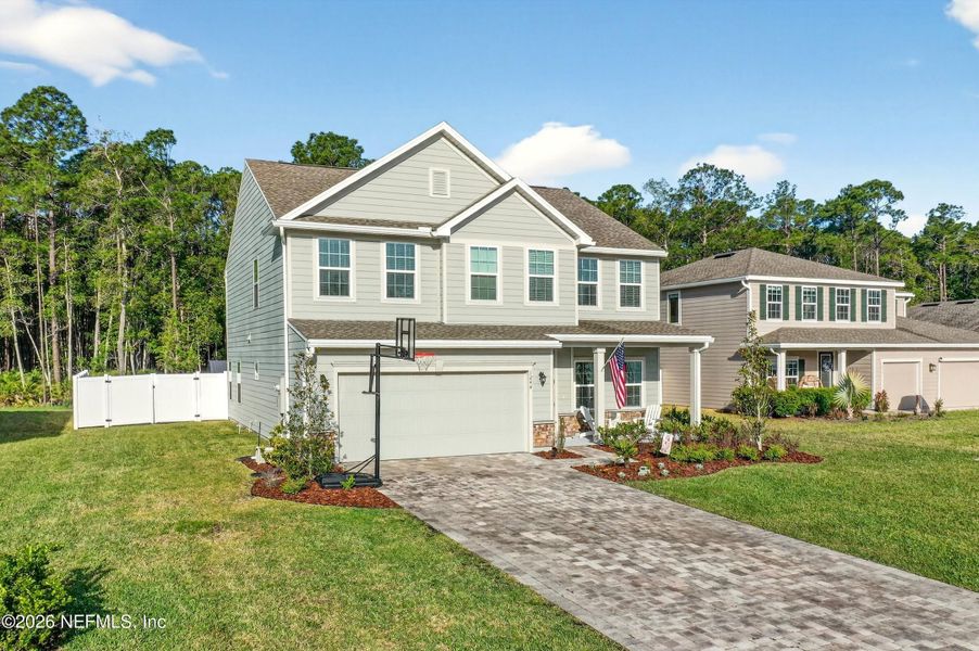 Front exterior of a new home in Terra Pines, St. Augustine, FL, highlighting curb appeal (Image 20).