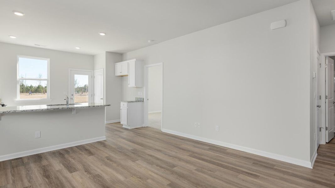 Representative unfurnished interior of a home built from the PERRY by D.R. Horton in The Cottages at Blake Farm, Wilmington (Image 7).