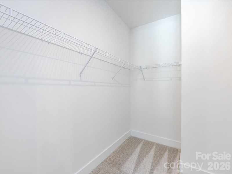 Primary Walk-In Closet Primary Walk-In Closet