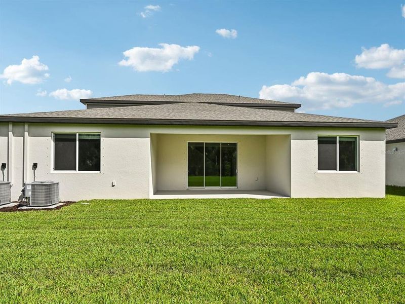 Exterior details and patio area of a home in Oakfield Trails - Signature Series, Parrish (Image 4).