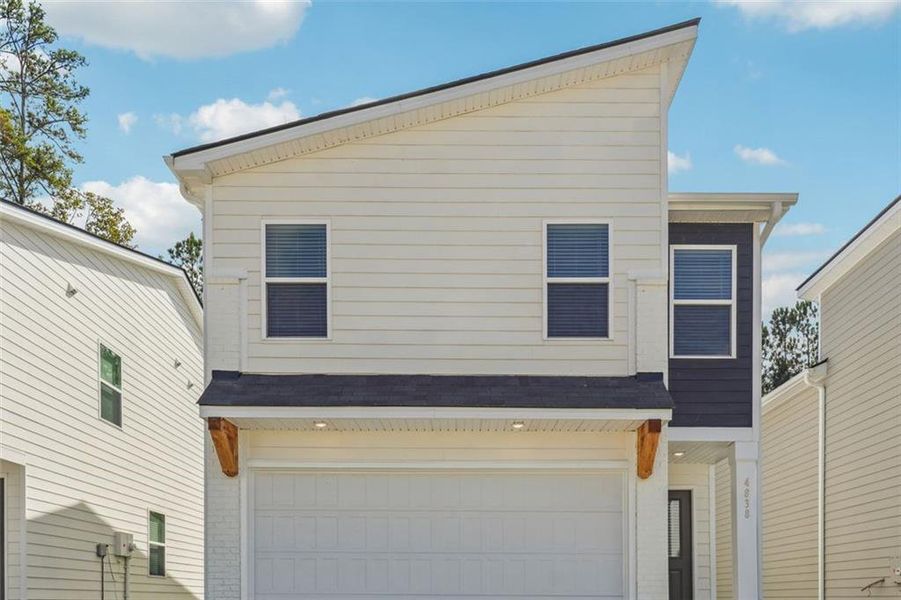 Exterior details and patio area of a home in The Enclave at Stonewall Station, Union City (Image 1).